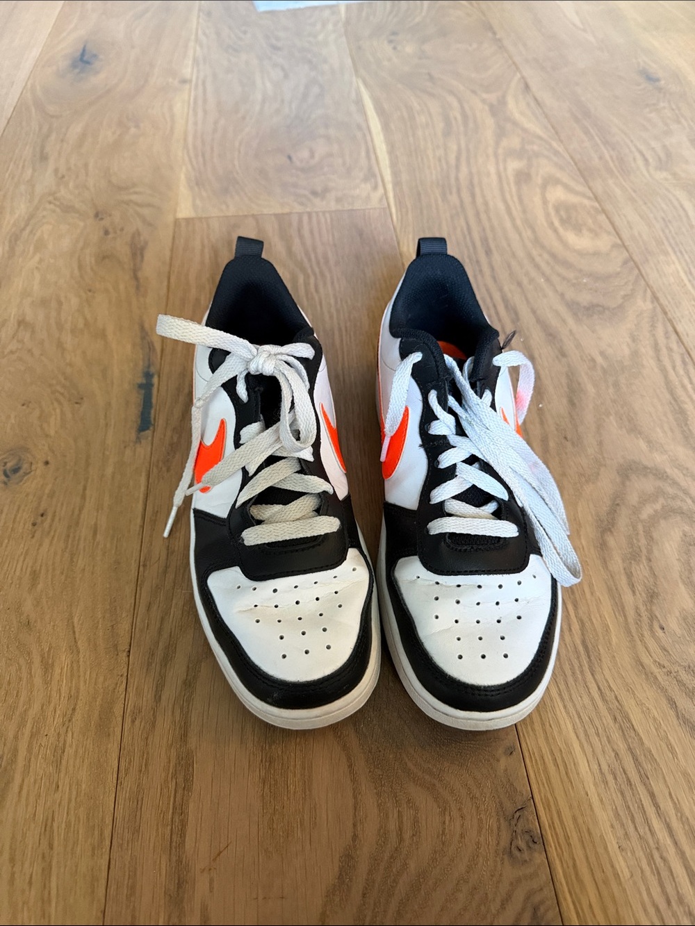 Nike Kids Black White Sneakers with Orange Swoosh